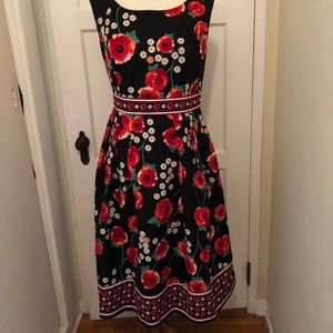 Eva Mendes Black floral flare dress.